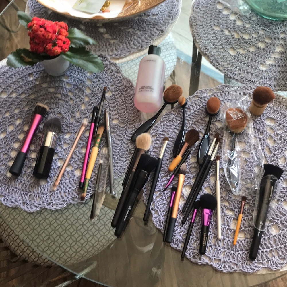 Assorted makeup brushes and brush cleaner